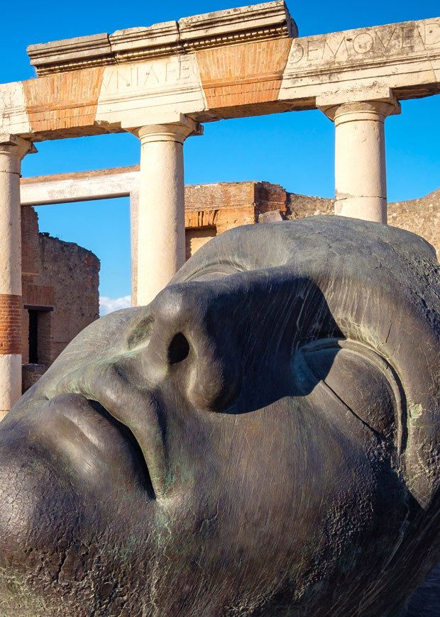 Bronze statue in ancient Pompeii city