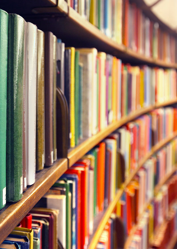 Books in a library, portrait crop