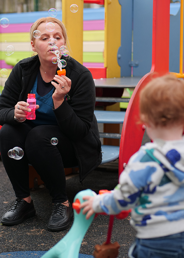 Adult playing with a child